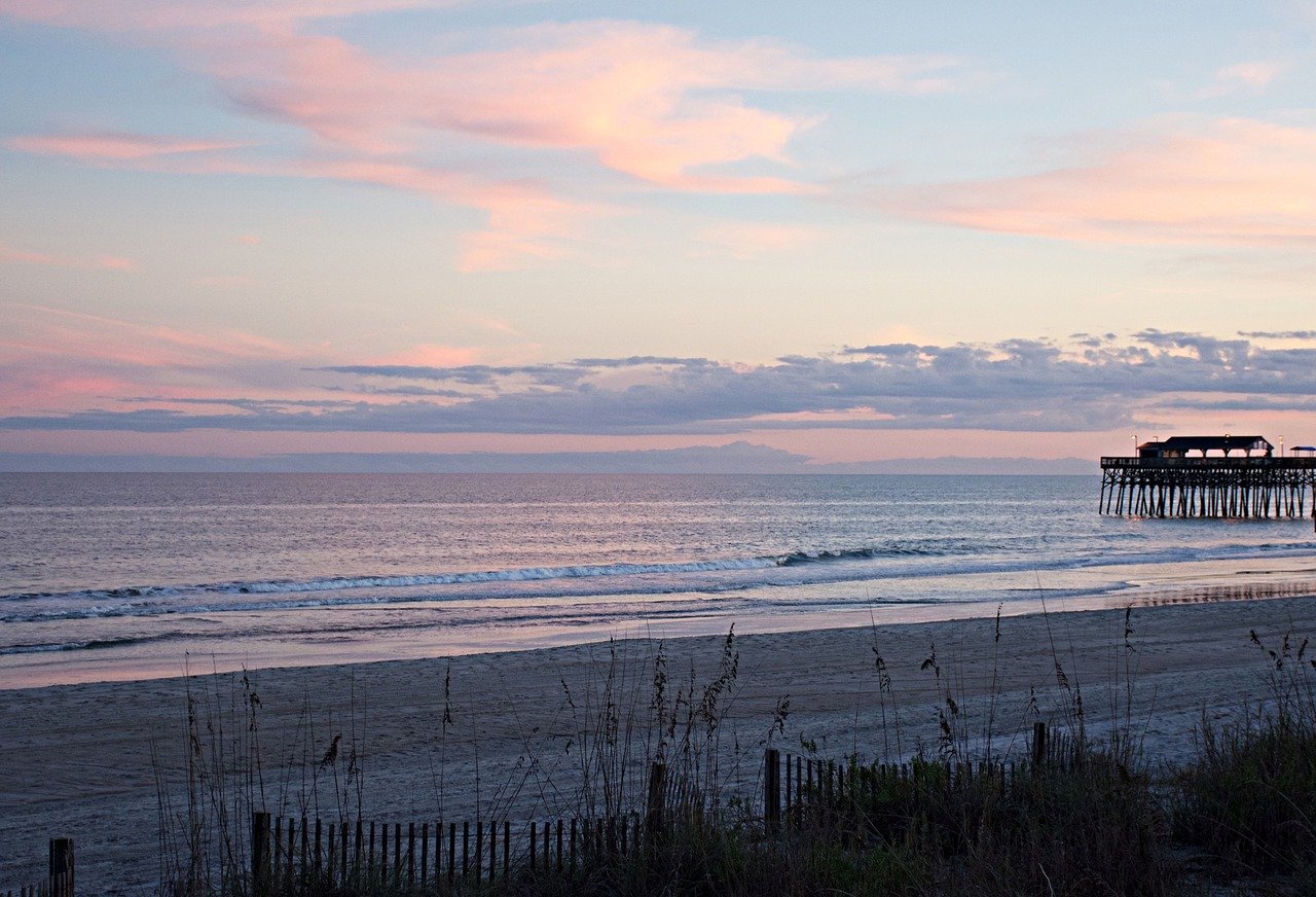 Myrtle Beach sunrise with cotton candy sky, ocean calm, sand