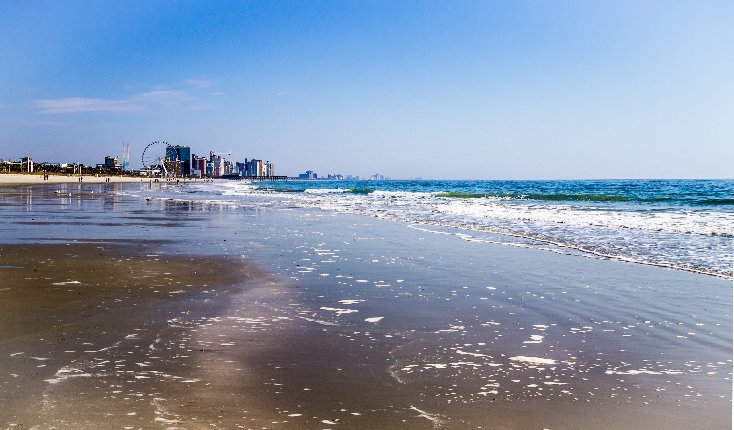 The wide sand beach's of South Carolina's beautiful Grand Strand with the Myrtle Beach skyline as the backdrop.